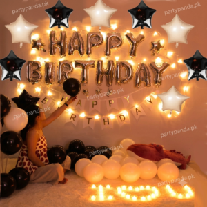 Elegant black and rose gold birthday balloon decoration with fairy lights by partypanda.pk.