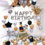 Elegant black and gold 18th birthday balloon decoration setup by partypanda.pk.